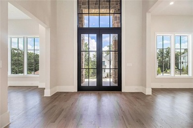 Set on a private 2.3-acre creek-lined homesite in the on Echelon Golf Club in Georgia - for sale on GolfHomes.com, golf home, golf lot