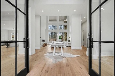 Set on a private 2.3-acre creek-lined homesite in the on Echelon Golf Club in Georgia - for sale on GolfHomes.com, golf home, golf lot