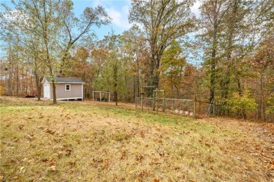 A charming 3-bedroom, 2-bath home on a relatively flat and on Bella Vista Country Club - Highlands in Arkansas - for sale on GolfHomes.com, golf home, golf lot