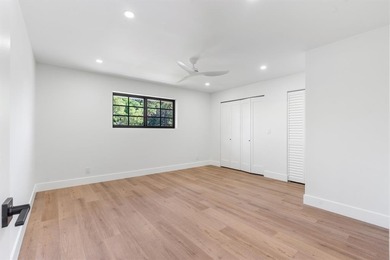 Nestled on a lush  1/2 -acre lot along prestigious Hickory Drive on BallenIsles Golf and Country Club in Florida - for sale on GolfHomes.com, golf home, golf lot