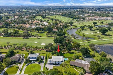 Nestled on a lush  1/2 -acre lot along prestigious Hickory Drive on BallenIsles Golf and Country Club in Florida - for sale on GolfHomes.com, golf home, golf lot
