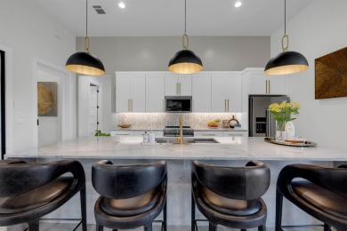 Welcome to 711 Twin Sails, where stunning views of Lake LBJ on Slick Rock Golf Course - Horseshoe Bay in Texas - for sale on GolfHomes.com, golf home, golf lot