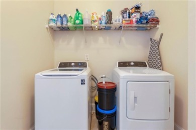 Welcome to 6857 Louis Drive, a beautiful all-brick home located on Canongate At Heron Bay in Georgia - for sale on GolfHomes.com, golf home, golf lot