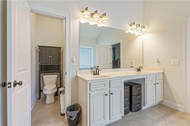 Welcome to 6857 Louis Drive, a beautiful all-brick home located on Canongate At Heron Bay in Georgia - for sale on GolfHomes.com, golf home, golf lot