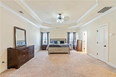 Welcome to 6857 Louis Drive, a beautiful all-brick home located on Canongate At Heron Bay in Georgia - for sale on GolfHomes.com, golf home, golf lot