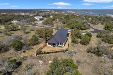 Welcome to 711 Twin Sails, where stunning views of Lake LBJ on Slick Rock Golf Course - Horseshoe Bay in Texas - for sale on GolfHomes.com, golf home, golf lot