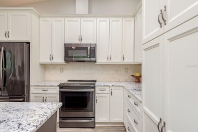 Discover the perfect blend of coastal charm and modern luxury in on The Dunedin Country Club in Florida - for sale on GolfHomes.com, golf home, golf lot