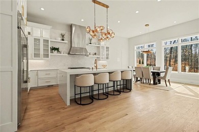 Set on a private 2.3-acre creek-lined homesite in the on Echelon Golf Club in Georgia - for sale on GolfHomes.com, golf home, golf lot