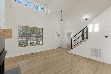 Nestled in the Holly Forest community of Sapphire, North on Sapphire National Golf Club in North Carolina - for sale on GolfHomes.com, golf home, golf lot