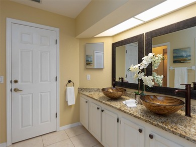 Discover Florida living in this immaculately maintained heated on Rotonda Golf and Country Club The Palms Course in Florida - for sale on GolfHomes.com, golf home, golf lot