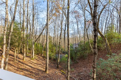 Nestled in the Holly Forest community of Sapphire, North on Sapphire National Golf Club in North Carolina - for sale on GolfHomes.com, golf home, golf lot