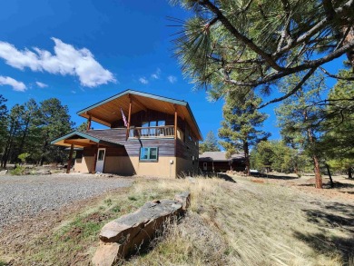 Nestled among tall Ponderosa Pine trees and less than one hour on The Divide Ranch and Club in Colorado - for sale on GolfHomes.com, golf home, golf lot