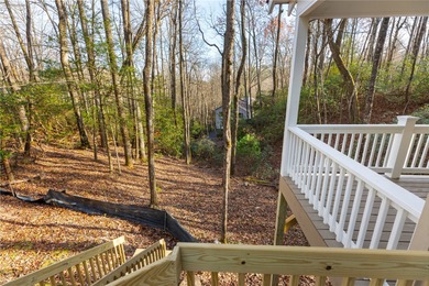 Nestled in the Holly Forest community of Sapphire, North on Sapphire National Golf Club in North Carolina - for sale on GolfHomes.com, golf home, golf lot