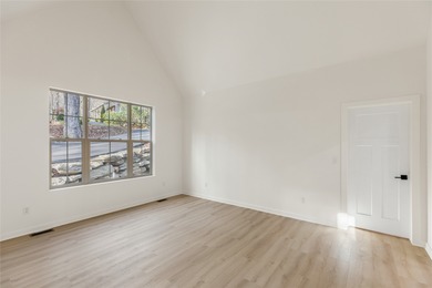 Nestled in the Holly Forest community of Sapphire, North on Sapphire National Golf Club in North Carolina - for sale on GolfHomes.com, golf home, golf lot