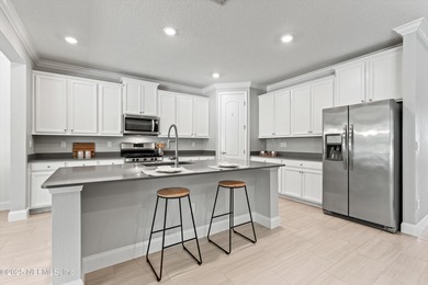 Welcome to this 3-car garage Palencia home with a split on The Palencia Club in Florida - for sale on GolfHomes.com, golf home, golf lot