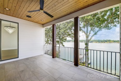 Indulge in lakeside luxury within this meticulously renovated on Tega Cay Golf Club in South Carolina - for sale on GolfHomes.com, golf home, golf lot