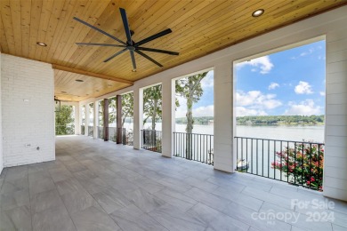 Indulge in lakeside luxury within this meticulously renovated on Tega Cay Golf Club in South Carolina - for sale on GolfHomes.com, golf home, golf lot