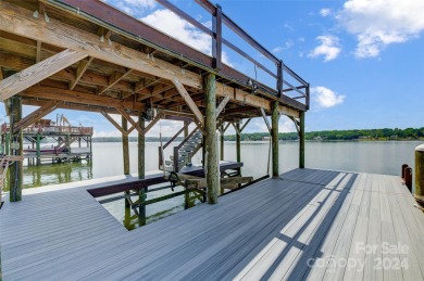 Indulge in lakeside luxury within this meticulously renovated on Tega Cay Golf Club in South Carolina - for sale on GolfHomes.com, golf home, golf lot