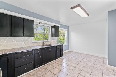 Discover this beautifully updated 1,400 sqft ranch, perfect for on Flushing Valley Golf and Country Club in Michigan - for sale on GolfHomes.com, golf home, golf lot