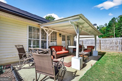 Welcome to this charming 3 bedroom, 2 bath ranch home with a on Summergrove Golf Club in Georgia - for sale on GolfHomes.com, golf home, golf lot