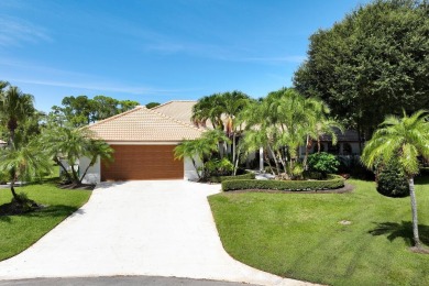 Discover luxury living in the heart of PGA National's on PGA National Golf Club in Florida - for sale on GolfHomes.com, golf home, golf lot
