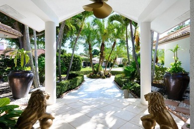 Discover luxury living in the heart of PGA National's on  in Florida - for sale on GolfHomes.com, golf home, golf lot