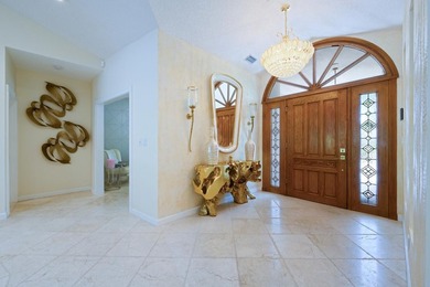Discover luxury living in the heart of PGA National's on  in Florida - for sale on GolfHomes.com, golf home, golf lot
