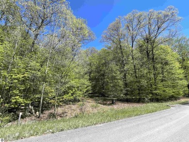 Surround yourself among nature and endless recreation on Manitou Passage Golf Club in Michigan - for sale on GolfHomes.com, golf home, golf lot