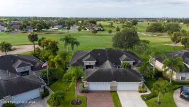 Discover unparalleled luxury in this charming villa nestled on a on Viera East Golf Club in Florida - for sale on GolfHomes.com, golf home, golf lot