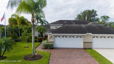 Discover unparalleled luxury in this charming villa nestled on a on Viera East Golf Club in Florida - for sale on GolfHomes.com, golf home, golf lot