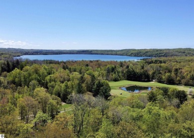 Surround yourself among nature and endless recreation on Manitou Passage Golf Club in Michigan - for sale on GolfHomes.com, golf home, golf lot