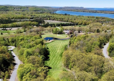 Surround yourself among nature and endless recreation on Manitou Passage Golf Club in Michigan - for sale on GolfHomes.com, golf home, golf lot