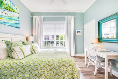 This stunning southern-exposure end unit offers some of the most on West Bay Beach and Golf Club in Florida - for sale on GolfHomes.com, golf home, golf lot