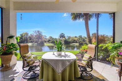 This first floor coach home has a spectacular lake and island on Lely Resort Golf and Country Club in Florida - for sale on GolfHomes.com, golf home, golf lot