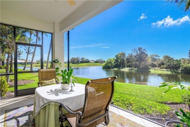 This first floor coach home has a spectacular lake and island on Lely Resort Golf and Country Club in Florida - for sale on GolfHomes.com, golf home, golf lot