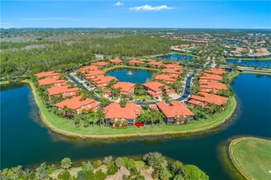 This first floor coach home has a spectacular lake and island on Lely Resort Golf and Country Club in Florida - for sale on GolfHomes.com, golf home, golf lot