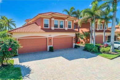 This first floor coach home has a spectacular lake and island on Lely Resort Golf and Country Club in Florida - for sale on GolfHomes.com, golf home, golf lot