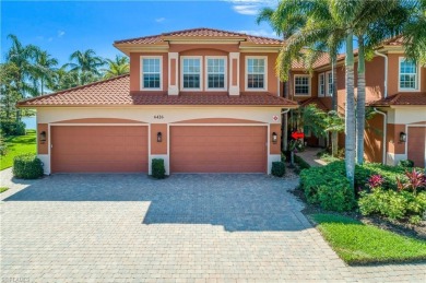 This first floor coach home has a spectacular lake and island on Lely Resort Golf and Country Club in Florida - for sale on GolfHomes.com, golf home, golf lot