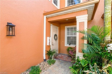 This first floor coach home has a spectacular lake and island on Lely Resort Golf and Country Club in Florida - for sale on GolfHomes.com, golf home, golf lot