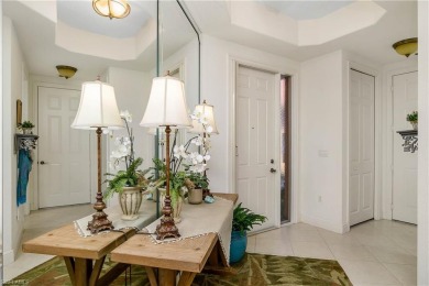 This first floor coach home has a spectacular lake and island on Lely Resort Golf and Country Club in Florida - for sale on GolfHomes.com, golf home, golf lot