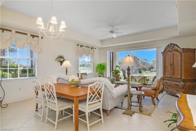 This first floor coach home has a spectacular lake and island on Lely Resort Golf and Country Club in Florida - for sale on GolfHomes.com, golf home, golf lot