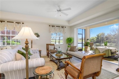 This first floor coach home has a spectacular lake and island on Lely Resort Golf and Country Club in Florida - for sale on GolfHomes.com, golf home, golf lot