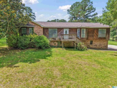 Nestled on a spacious lot alongside the golf course, this home on Cumberland Lake Country Club in Alabama - for sale on GolfHomes.com, golf home, golf lot