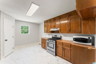 Nestled on a spacious lot alongside the golf course, this home on Cumberland Lake Country Club in Alabama - for sale on GolfHomes.com, golf home, golf lot