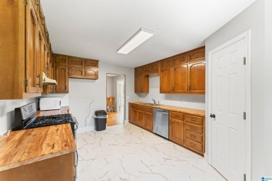 Nestled on a spacious lot alongside the golf course, this home on Cumberland Lake Country Club in Alabama - for sale on GolfHomes.com, golf home, golf lot