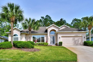 Look no further than this Tiffany model that backs up to a on Plantation Bay Golf and Country Club in Florida - for sale on GolfHomes.com, golf home, golf lot