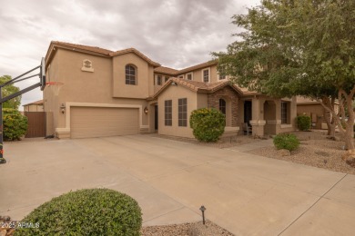 This expansive 5-bedroom, 3-bath home offers over 4,100 square on The Golf Club At Johnson Ranch in Arizona - for sale on GolfHomes.com, golf home, golf lot