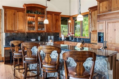 This exceptional 4-bedroom, 5-bathroom mountain retreat offers on Raven Golf Club At Three Peaks in Colorado - for sale on GolfHomes.com, golf home, golf lot
