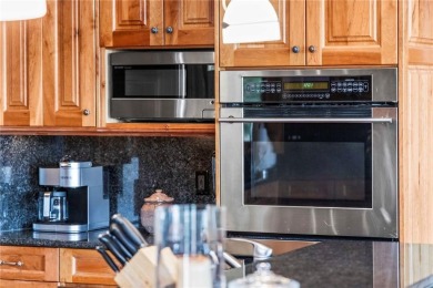 This exceptional 4-bedroom, 5-bathroom mountain retreat offers on Raven Golf Club At Three Peaks in Colorado - for sale on GolfHomes.com, golf home, golf lot