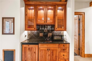 This exceptional 4-bedroom, 5-bathroom mountain retreat offers on Raven Golf Club At Three Peaks in Colorado - for sale on GolfHomes.com, golf home, golf lot